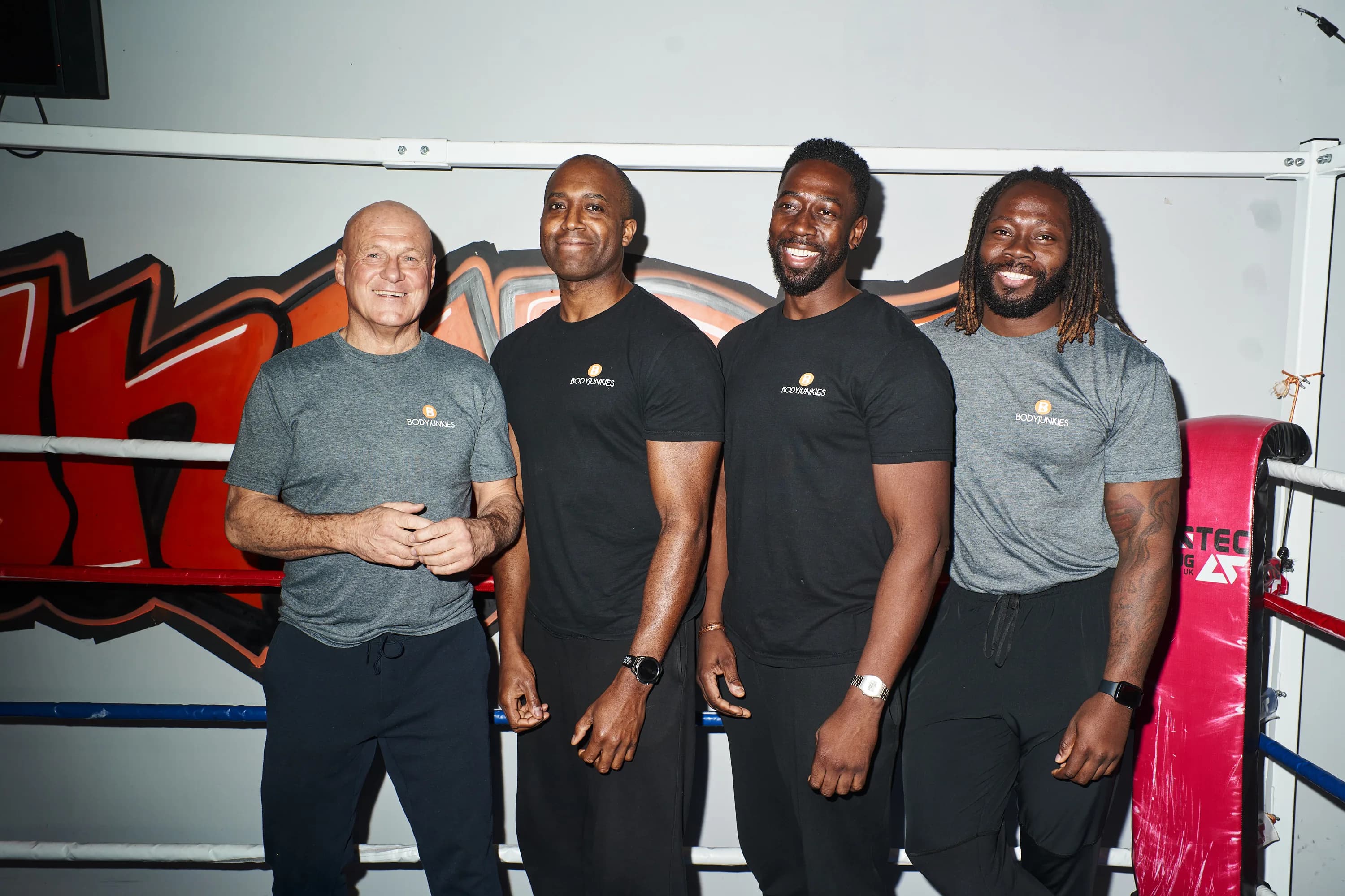 Bodyjunkies trainers together on the gym floor