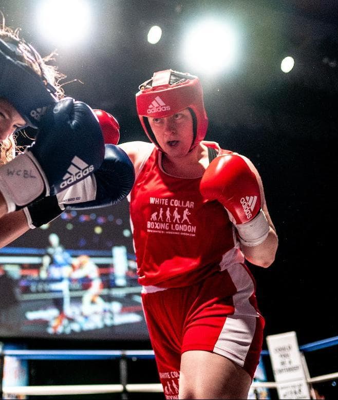Rachel H., Bodyjunkies white collar boxer (1-0)